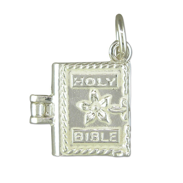Sterling silver Bible-shaped charm with polished finish and jump ring attachment, designed for charm bracelets or necklaces.